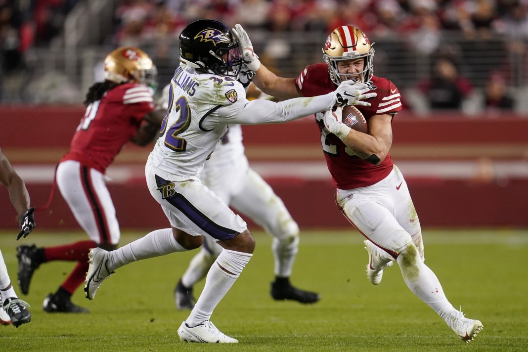 San Francisco 49ers running back Christian McCaffrey (23) stiff arms Baltimore Ravens safety Marcus Williams (32) in the third quarter at Levi's Stadium