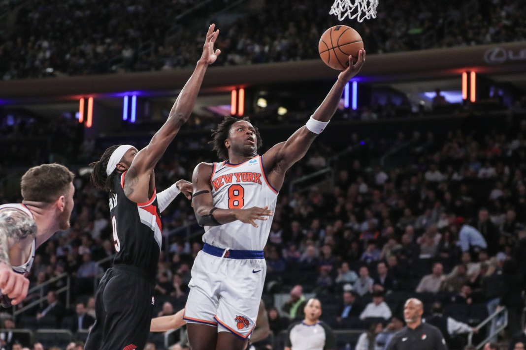 New York Knicks forward OG Anunoby dribbles against Philadelphia 76ers forward Tobias Harris during game two of the 2024 NBA playoffs.