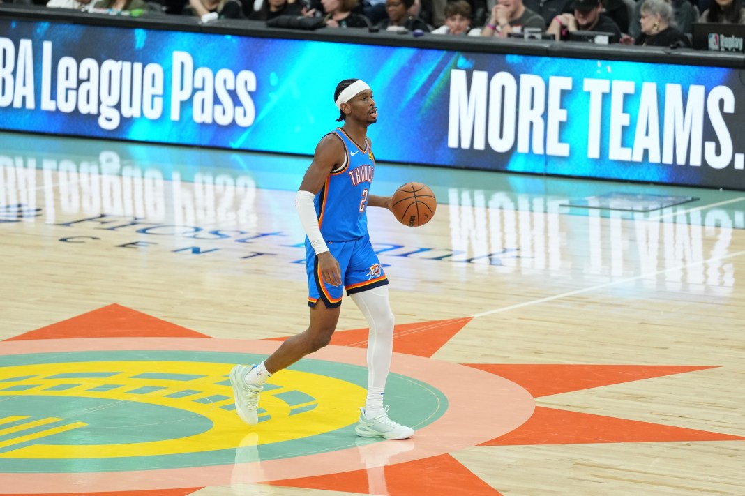 Oklahoma City Thunder guard Shai Gilgeous-Alexander brings the ball up the court against the San Antonio Spurs.