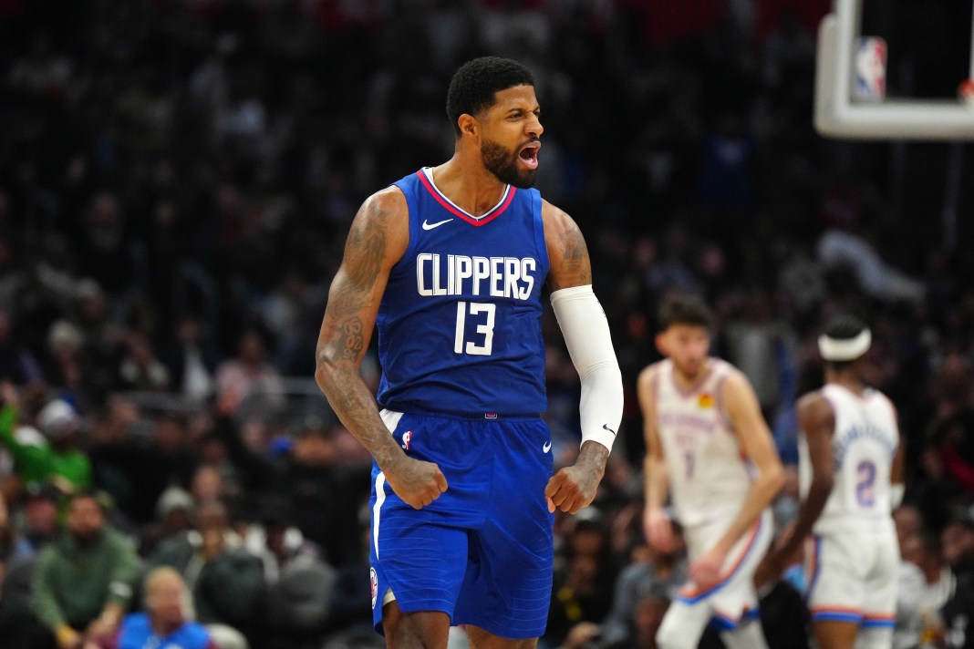 LA Clippers forward Paul George celebrates against the Oklahoma City Thunder in the second half at Crypto.com Arena.