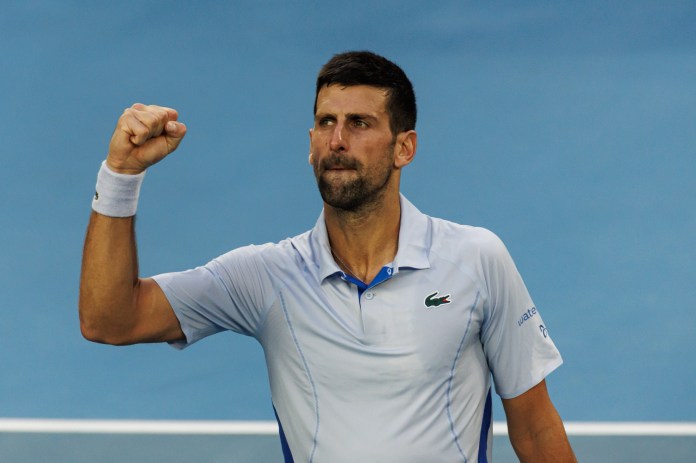 Novak Djokovic of Serbia celebrates his victory against Taylor Fritz of the United States in the quarter final of the men's singles.