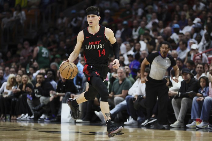 Miami Heat guard Tyler Herro dribbles the basketball against the Boston Celtics during the third quarter at Kaseya Center.