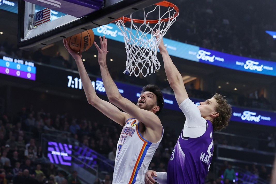 Oklahoma City Thunder forward Chet Holmgren shoots a lay up against Utah Jazz forward Lauri Markkanen.