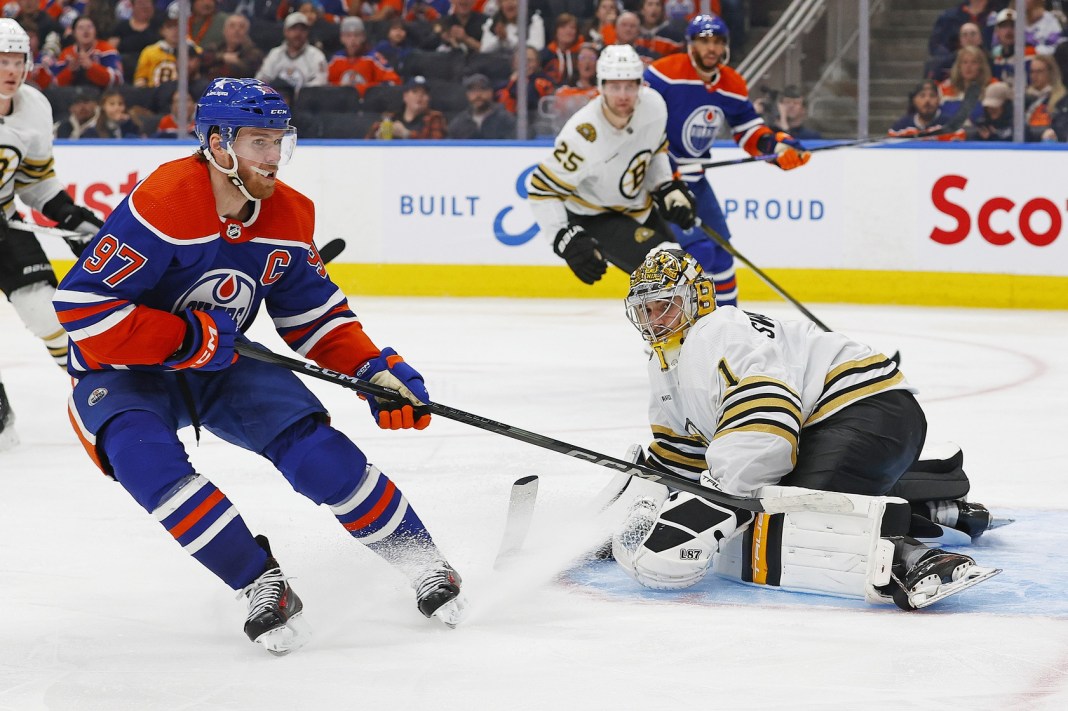 Boston Bruins goaltender Jeremy Swayman makes a save on on Edmonton Oilers forward Connor McDavid during the third period at Rogers Place.