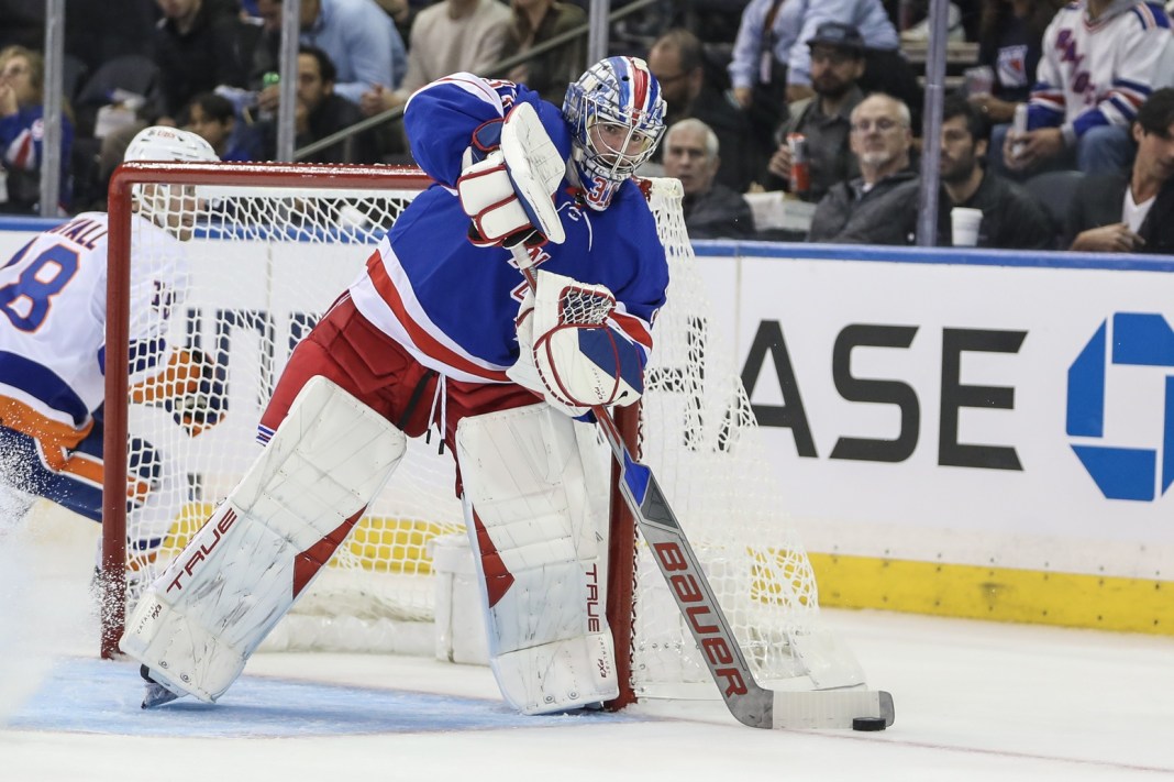 New York Rangers goaltender Igor Shesterkin plays the puck against the Carolina Hurricanes in game two of the 2024 Stanley Cup Playoffs.