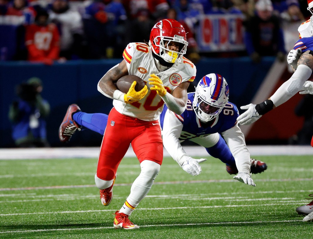 Kansas City Chiefs running back Isiah Pacheco beats a tackle.