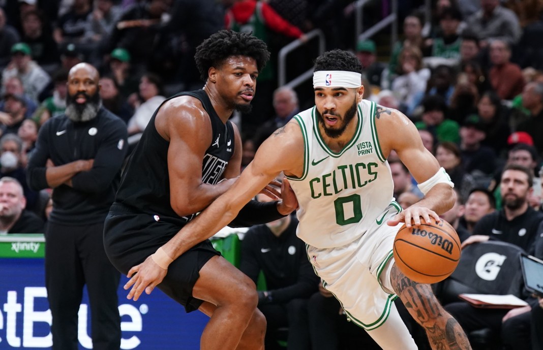 Boston Celtics forward Jayson Tatum drives the ball against Brooklyn Nets guard Dennis Smith Jr. in the first half at TD Garden.