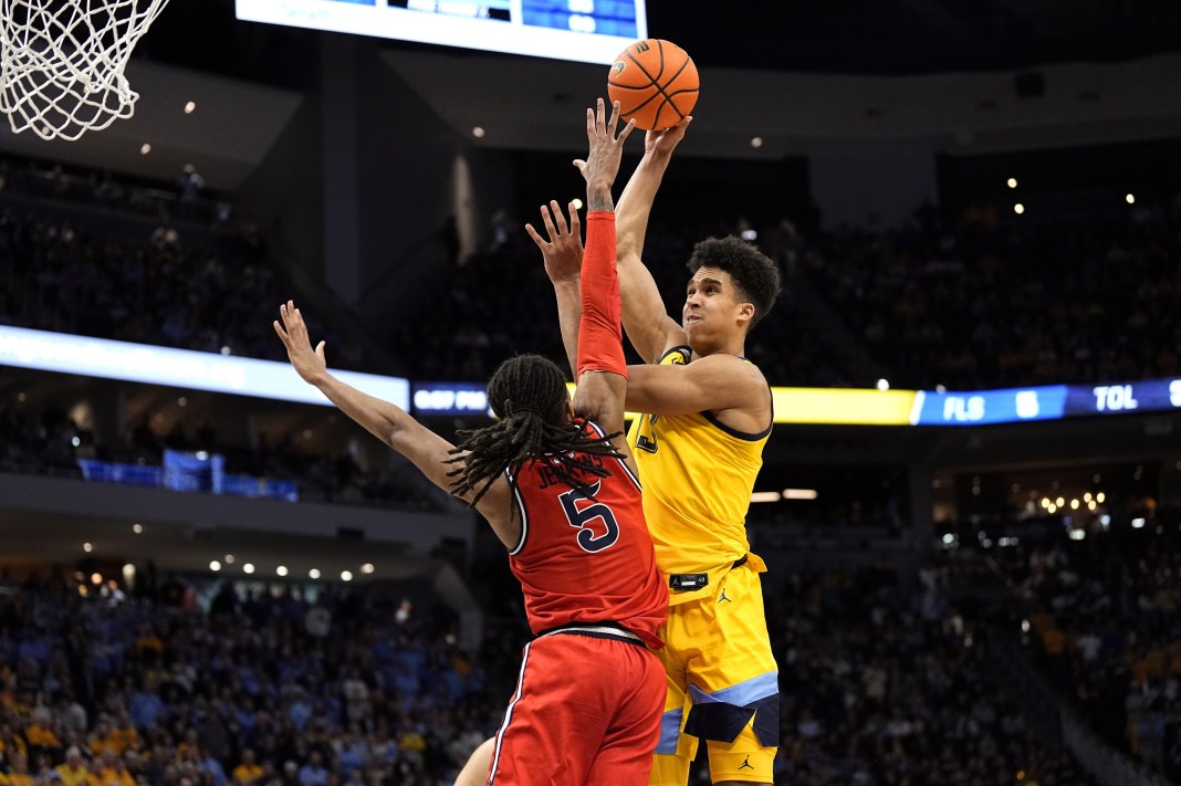 Marquette Golden Eagles forward Oso Ighodaro (13) shoots over St. John's Red Storm guard Daniss Jenkins (5)