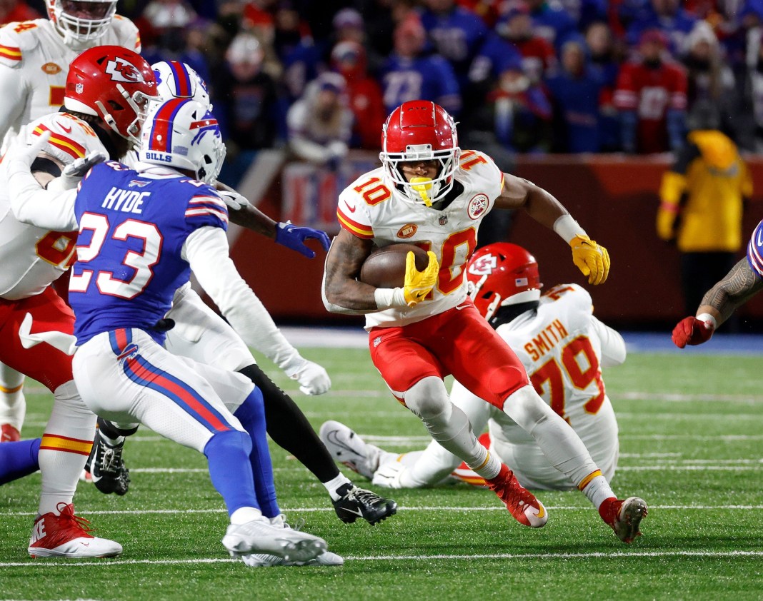 Kansas City Chiefs running back Isiah Pacheco cuts back for a short gain.