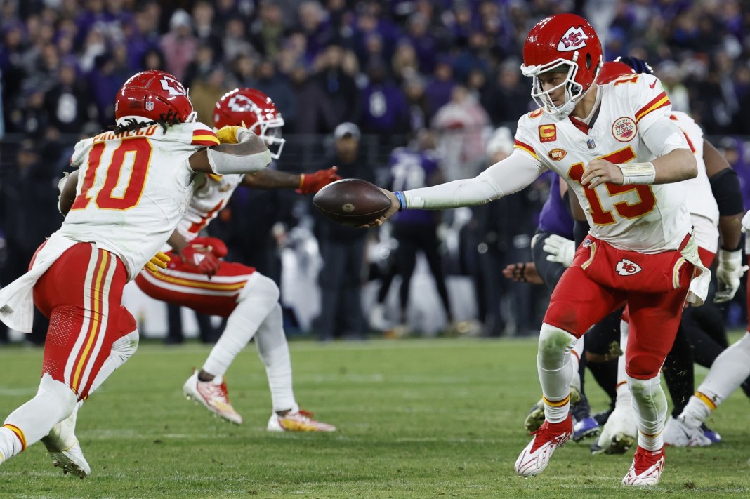 Chiefs quarterback Patrick Mahomes hands the ball to running back Isiah Pacheco against the Ravens in the AFC Championship.