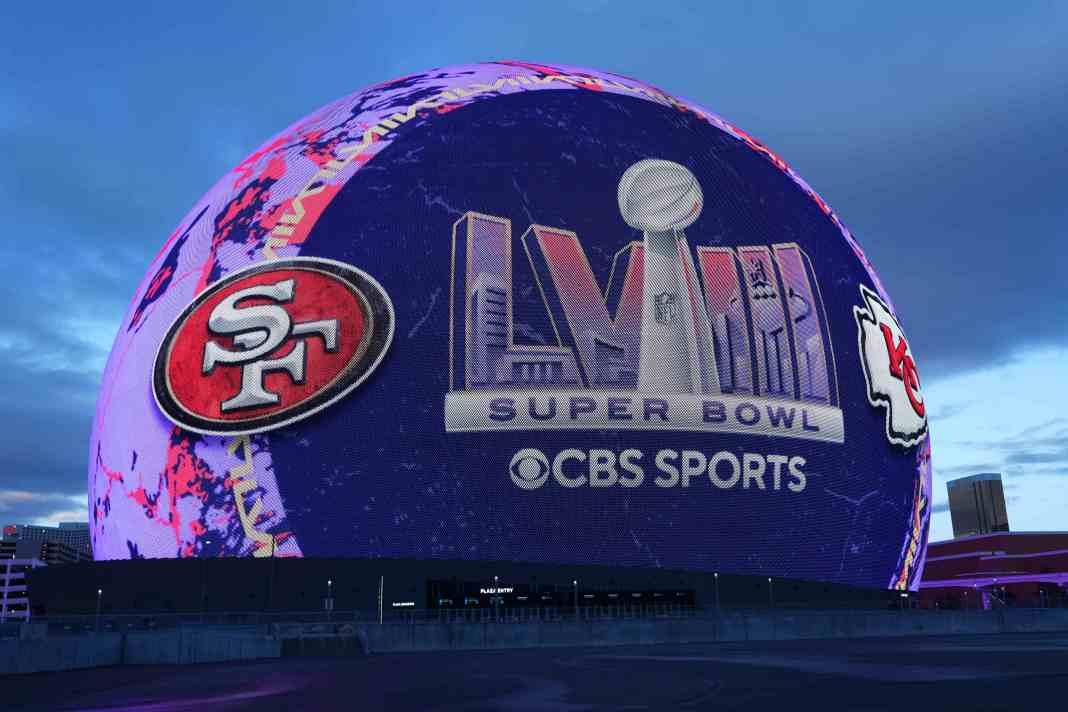 A large spherical screen displays "Super Bowl LVIII," CBS Sports, and team logos for the San Francisco 49ers and Kansas City Chiefs.