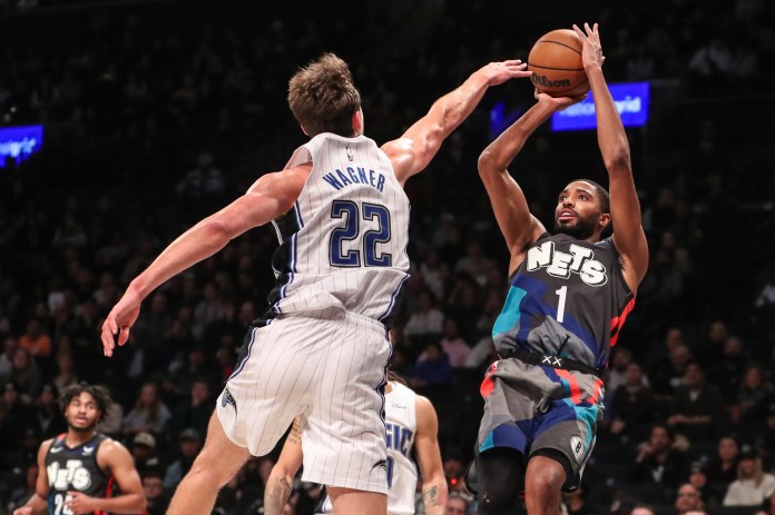 Brooklyn Nets forward Mikal Bridges shoots over Orlando Magic forward Franz Wagner in the fourth quarter at Barclays Center.