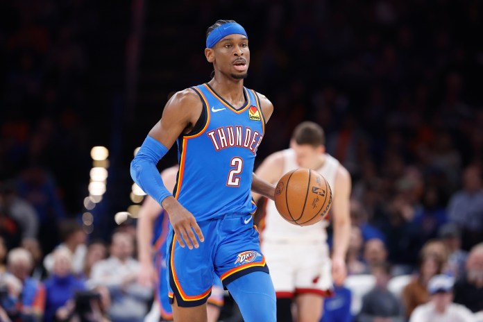 Oklahoma City Thunder guard Shai Gilgeous-Alexander dribbles the ball against the Miami Heat.