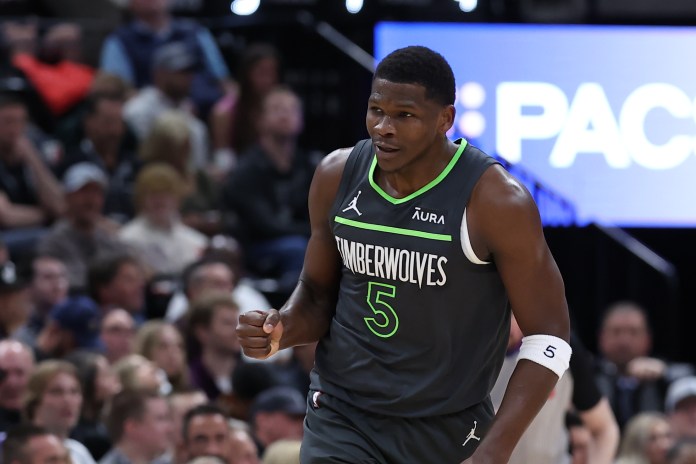 Minnesota Timberwolves guard Anthony Edwards (5) reacts to a play against the Utah Jazz