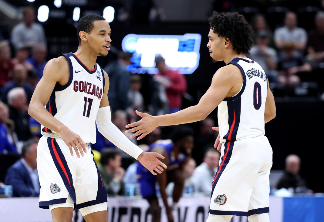 Gonzaga Bulldogs guard Nolan Hickman (11) and guard Ryan Nembhard (0) celebrate during the first half in the first round of the 2024 NCAA Tournament against the McNeese State Cowboys