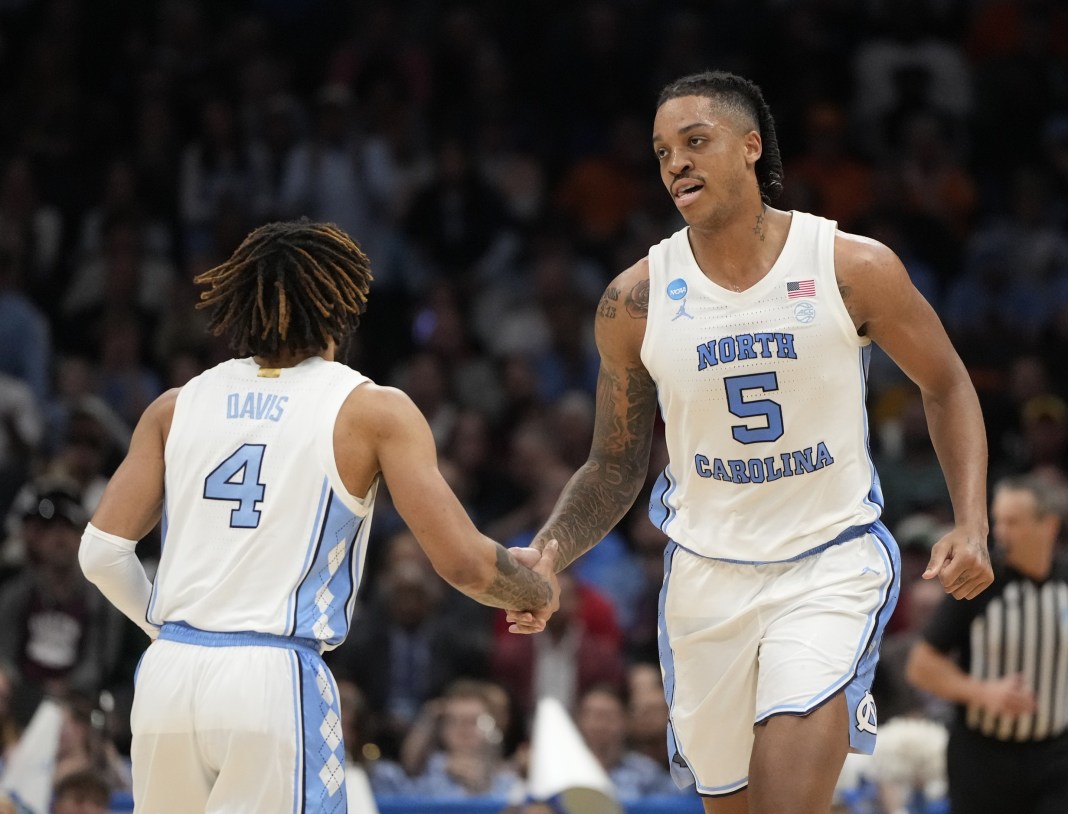 North Carolina Tar Heels forward Armando Bacot (5) and North Carolina Tar Heels guard RJ Davis (4) celebrate against the Michigan State Spartans.