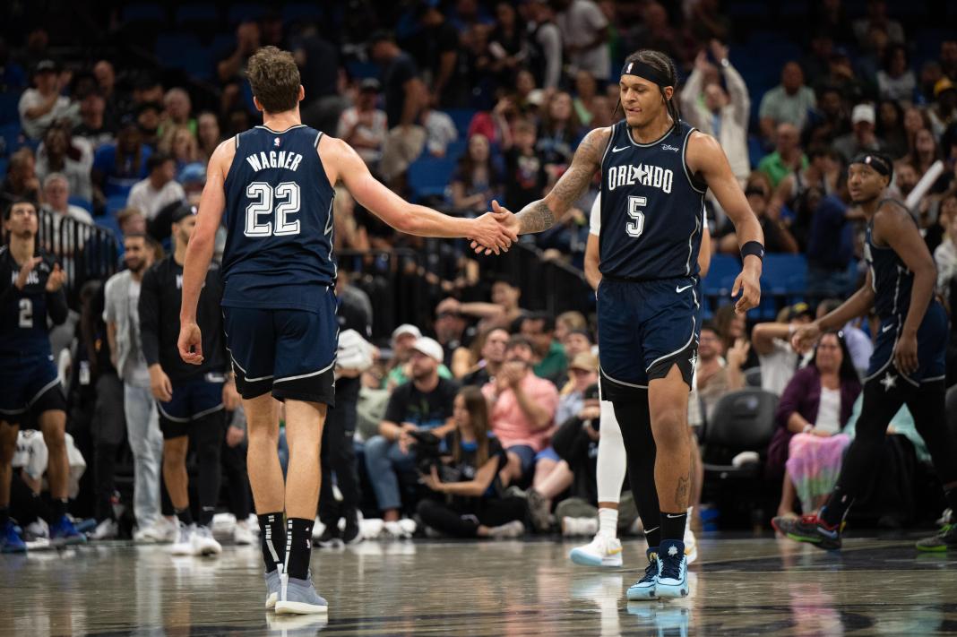 Orlando Magic forward Paolo Banchero celebrates with Franz Wagner against the Raptors.