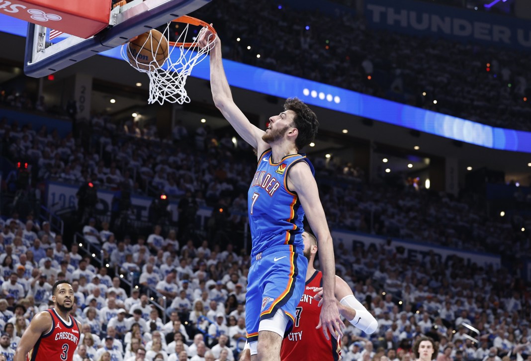 Oklahoma City Thunder forward Chet Holmgren (7) dunks against the New Orleans Pelicans during the second half of game two of the first round for the 2024 NBA playoffs at Paycom Center