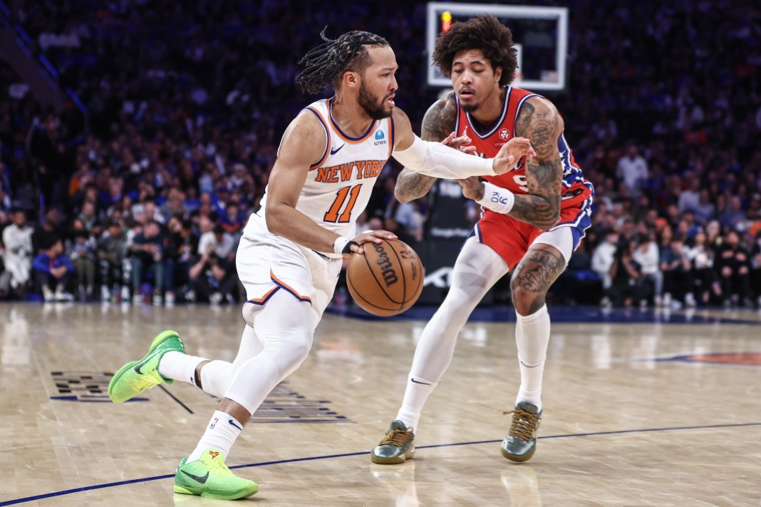 Knicks guard Jalen Brunson drives past 76ers' Kelly Oubre Jr. in the 2024 NBA playoffs.