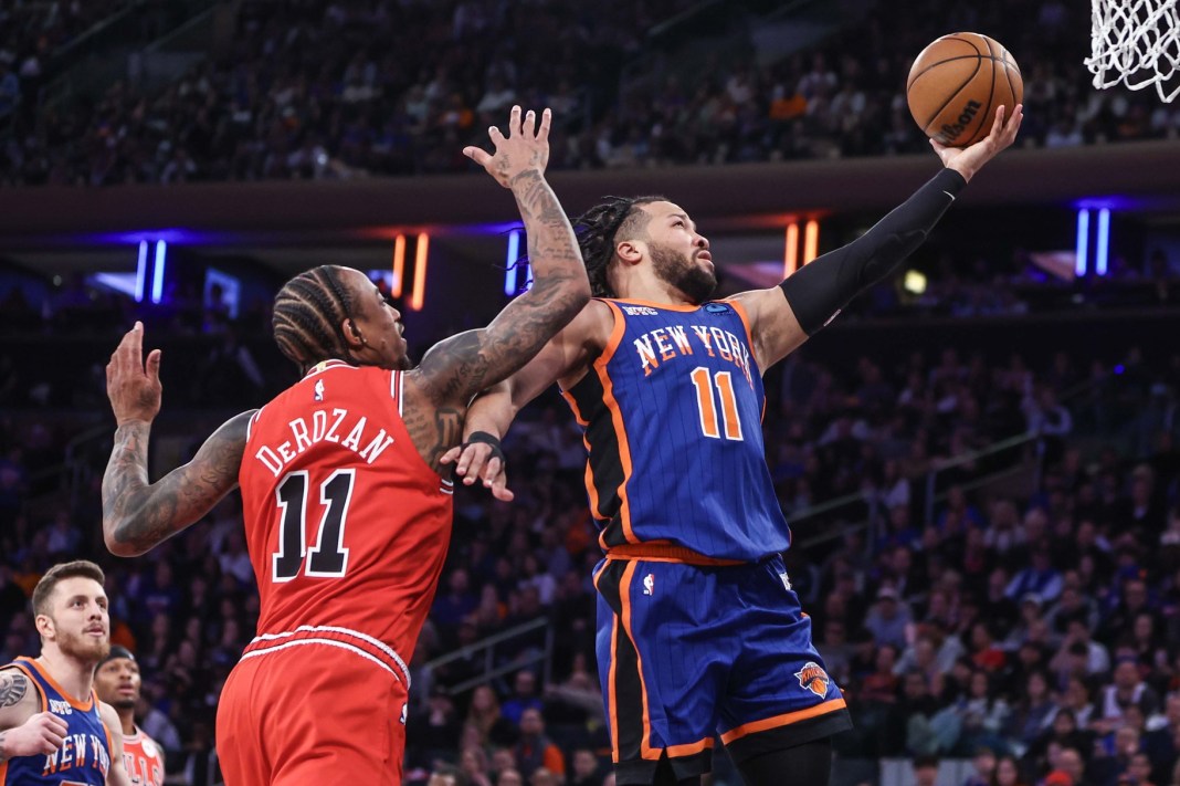 New York Knicks guard Jalen Brunson (11) drives past Chicago Bulls forward DeMar DeRozan (11) in the second quarter at Madison Square Garden