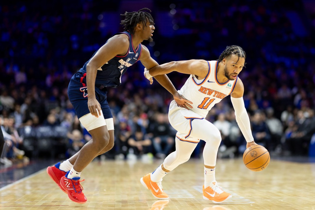 New York Knicks guard Jalen Brunson dribbles past Philadelphia 76ers guard Tyrese Maxey during the first quarter at Wells Fargo Center.