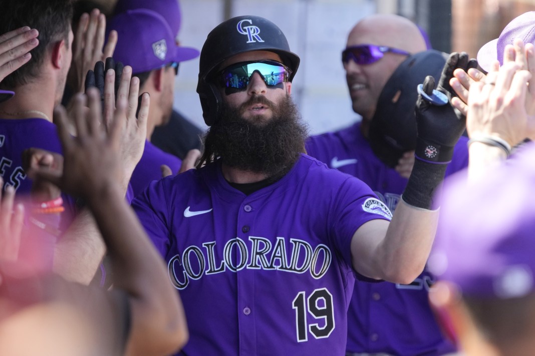 Colorado Rockies designated hitter Charlie Blackmon (19) celebrates with teammates after hitting a two run home run against the Chicago Cubs