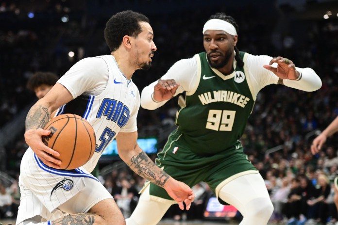 Orlando Magic guard Cole Anthony drives past Milwaukee Bucks forward Jae Crowder in the fourth quarter at Fiserv Forum.