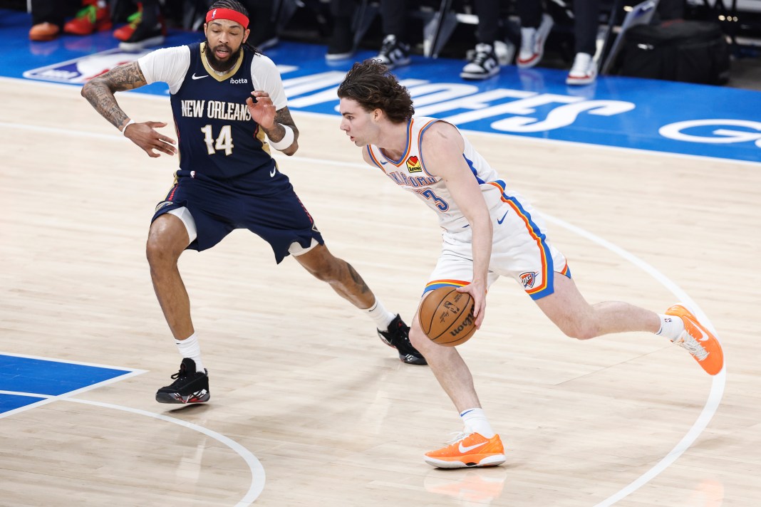 Oklahoma City Thunder guard Josh Giddey (3) drives to the basket around New Orleans Pelicans forward Brandon Ingram (14) during the first quarter of game one of the first round for the 2024 NBA playoffs at Paycom Center