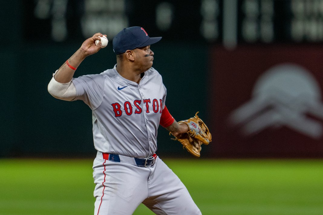 Boston Red Sox third baseman Rafael Devers throws out Oakland Athletics second baseman Zack Gelof.