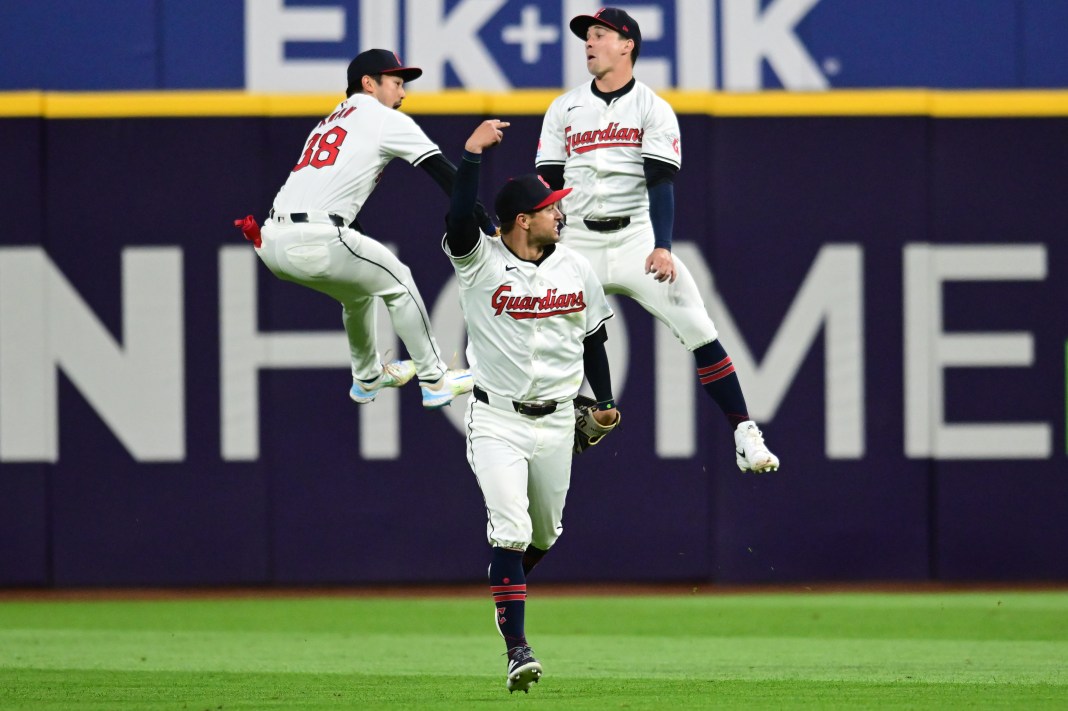 Cleveland Guardians center fielder Tyler Freeman and left fielder Steven Kwan and right fielder Will Brennan celebrate after the Guardians beat the Oakland Athletics at Progressive Field.