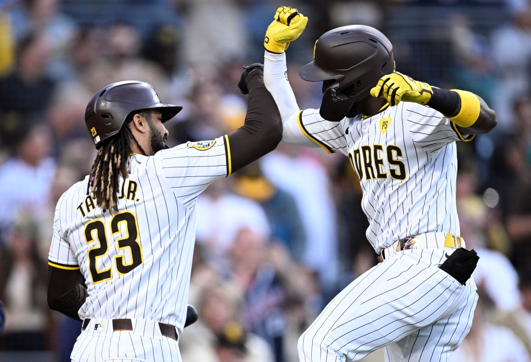 San Diego Padres left fielder Jurickson Profar (right) celebrates with right fielder Fernando Tatis Jr. (23) after hitting a home run against the Cincinnati Reds during the first inning at Petco Park.