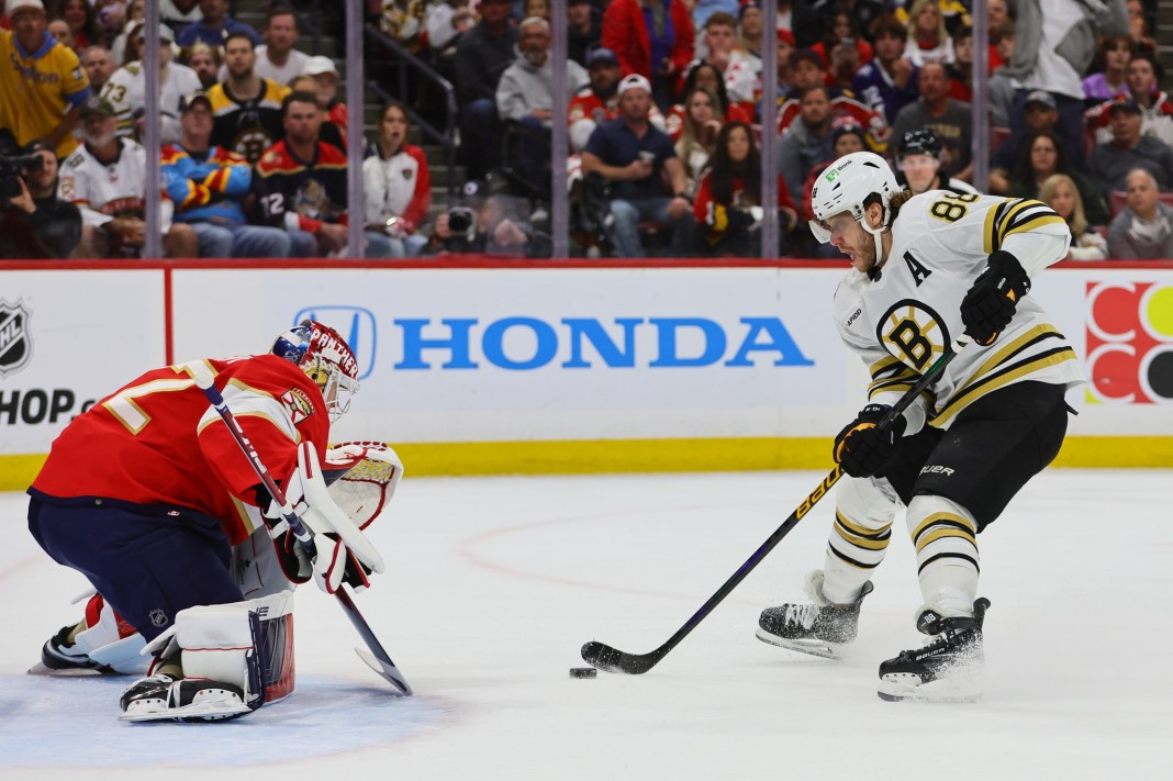 Boston Bruins right wing David Pastrnak shoots the puck against Florida Panthers goaltender Sergei Bobrovsky in the Stanley Cup Playoffs.