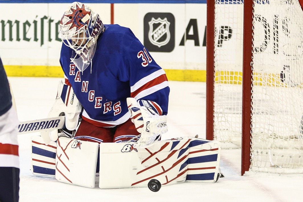 New York Rangers goaltender Igor Shesterkin passes the puck in the second period against the New York Islanders at Madison Square Garden.