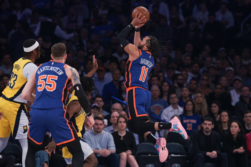 New York Knicks guard Jalen Brunson drives for a shot in front of Indiana Pacers center Myles Turner and center Isaiah Hartenstein