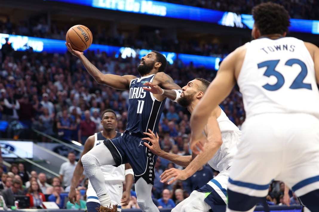 Dallas Mavericks guard Kyrie Irving shoots against the Minnesota Timberwolves during game four of the 2024 NBA playoffs.