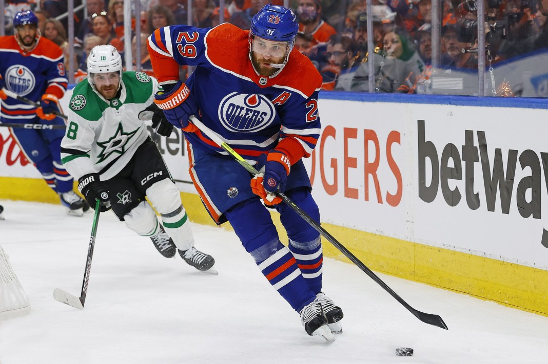 Edmonton Oilers forward Leon Draisaitl looks to make a pass in front of Dallas Stars forward Sam Steel in the 2024 Stanley Cup Playoffs.