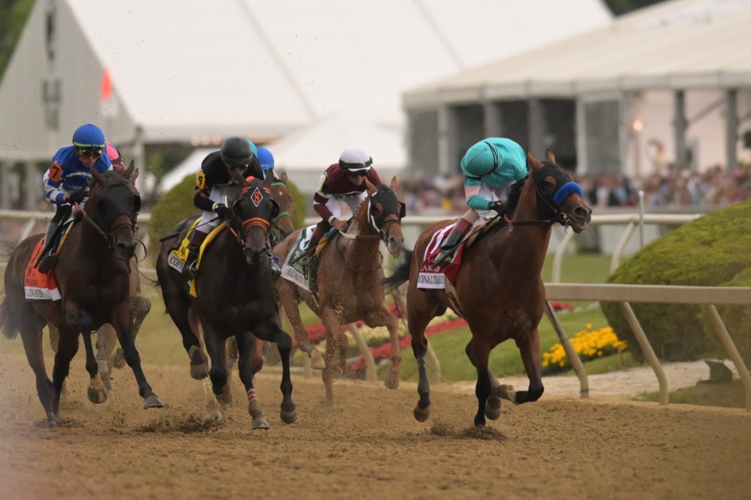 National Treasure with John R. Velazquez up (1) pulls away from the field during the running of the 148th Preakness Stakes at Pimlico Race Course