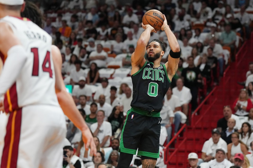 Boston Celtics forward Jayson Tatum (0) takes a shot against the Miami Heat