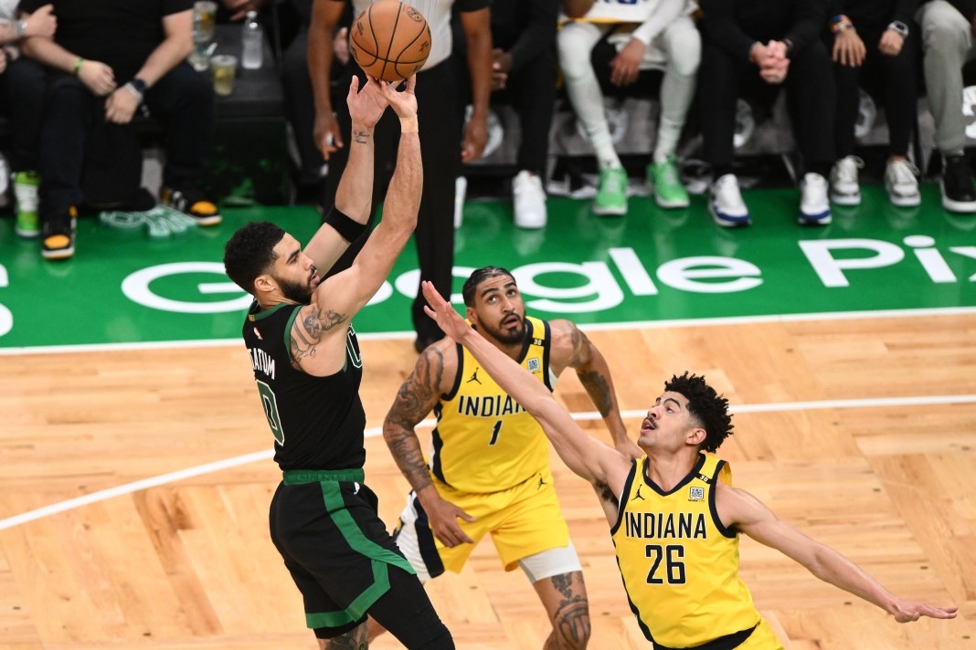 Boston Celtics forward Jayson Tatum (0) shoots the ball against the Indiana Pacers in the second half during game two of the eastern conference finals for the 2024 NBA playoffs at TD Garden