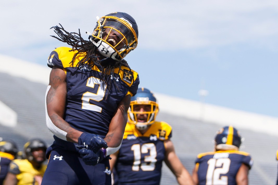 Showboats’ Daewood Davis celebrates after scoring a touchdown.