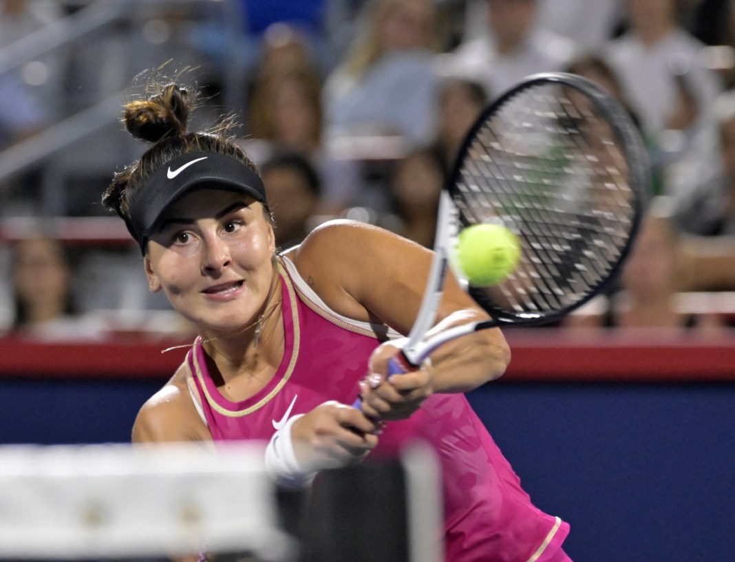 Bianca Andreescu hits a backhand against Camila Giorgi at the National Bank Open.