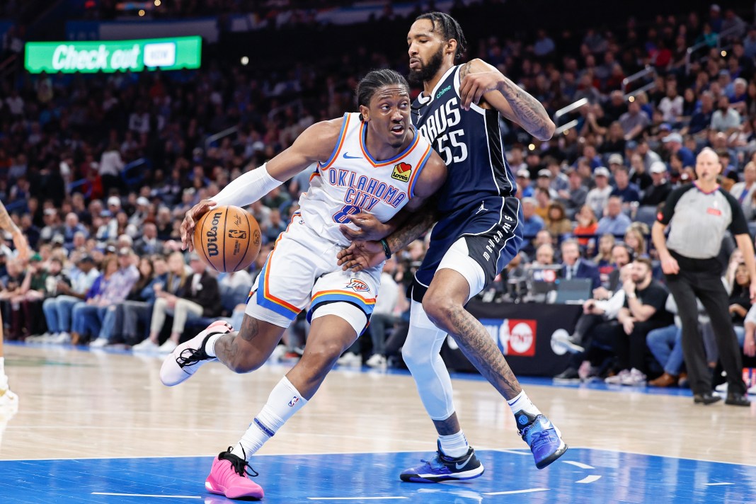 Oklahoma City Thunder forward Jalen Williams (8) drives to the basket around Dallas Mavericks forward Derrick Jones Jr. (55)