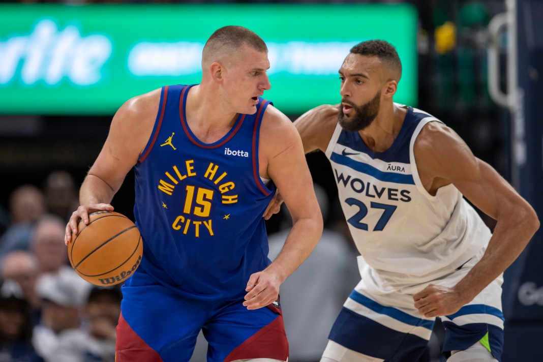 Denver Nuggets center Nikola Jokic controls the ball as Minnesota Timberwolves center Rudy Gobert defends during the 2024 NBA playoffs.