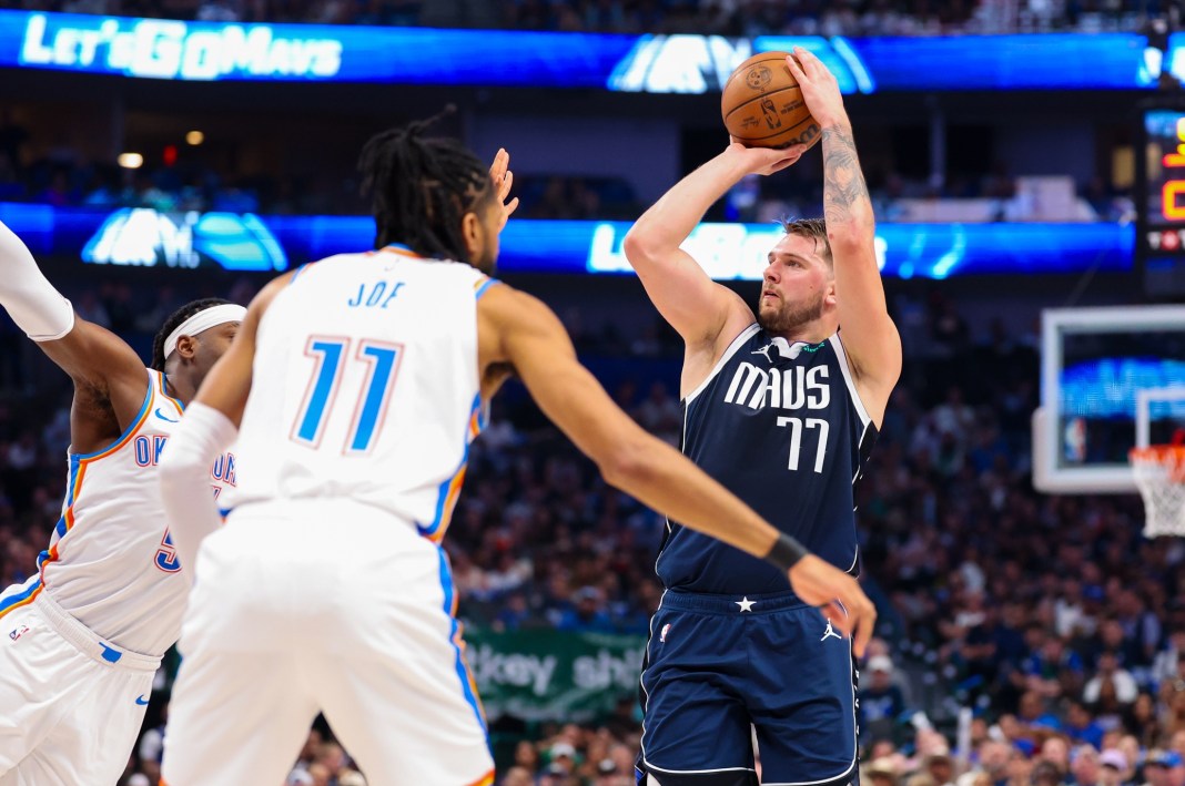 Dallas Mavericks guard Luka Doncic (77) shoots as Oklahoma City Thunder guard Isaiah Joe (11) defends during the first half during game three of the second round for the 2024 NBA playoffs at American Airlines Center