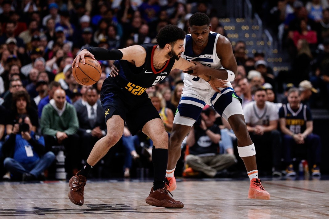 Denver Nuggets guard Jamal Murray (27) controls the ball as Minnesota Timberwolves guard Anthony Edwards (5) guards