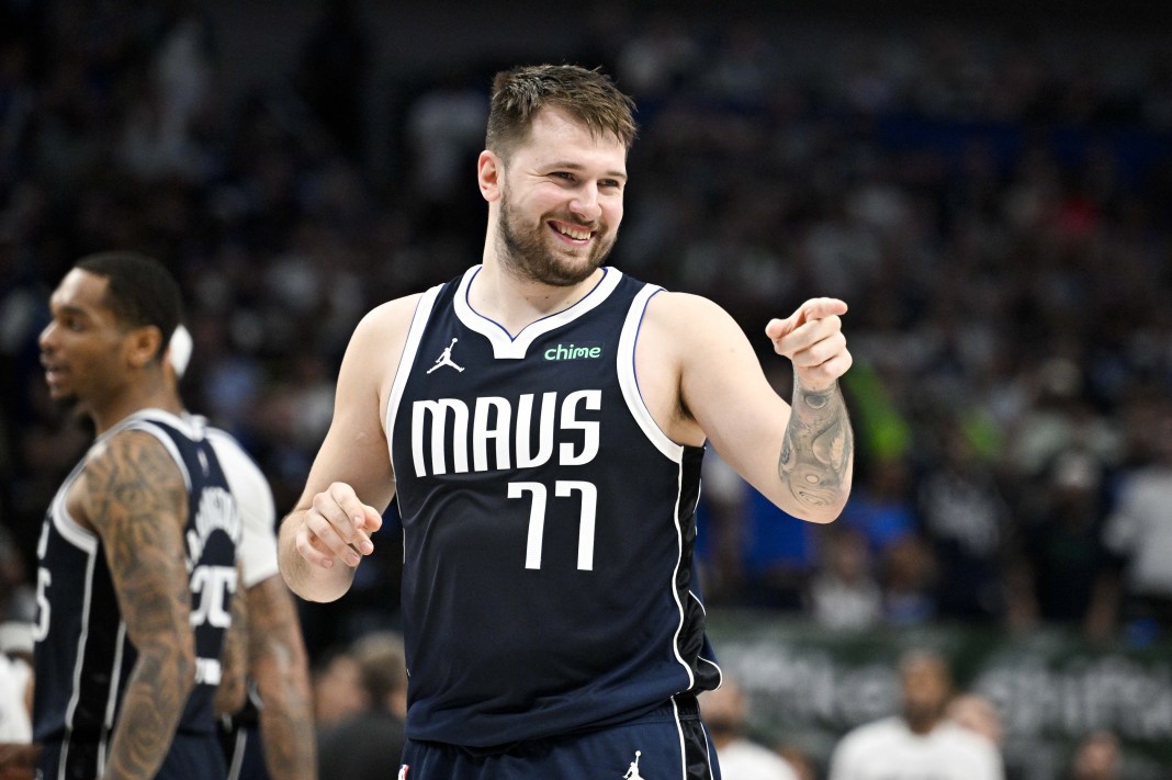 Dallas Mavericks guard Luka Doncic points to the crowd during a game against the Minnesota Timberwolves in the2024 NBA playoffs.