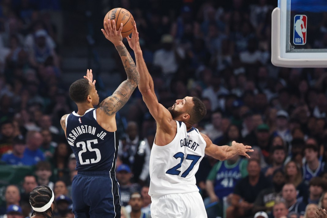 Minnesota Timberwolves center Rudy Gobert blocks Dallas Mavericks forward P.J. Washington during the 2024 NBA playoffs.