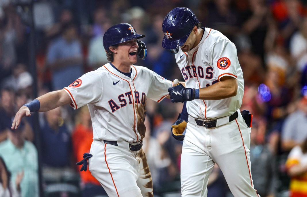 Houston Astros left fielder Joey Loperfido celebrates with center fielder Jake Meyers after hitting a home run during the third inning against the Oakland Athletics.