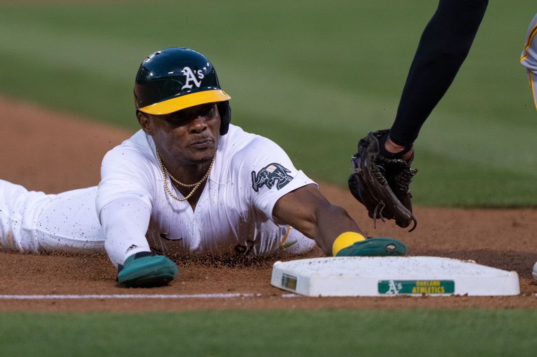 Oakland Athletics outfielder Esteury Ruiz slides into third base.