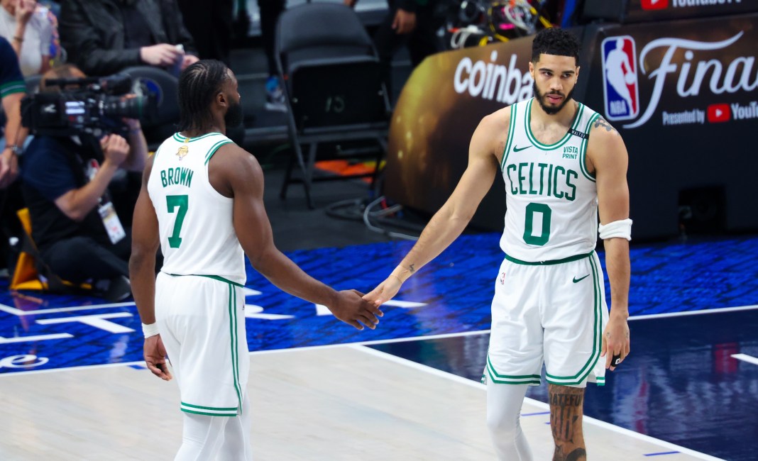 Celtics' Jayson Tatum and Jaylen Brown react during game four of the 2024 NBA Finals.